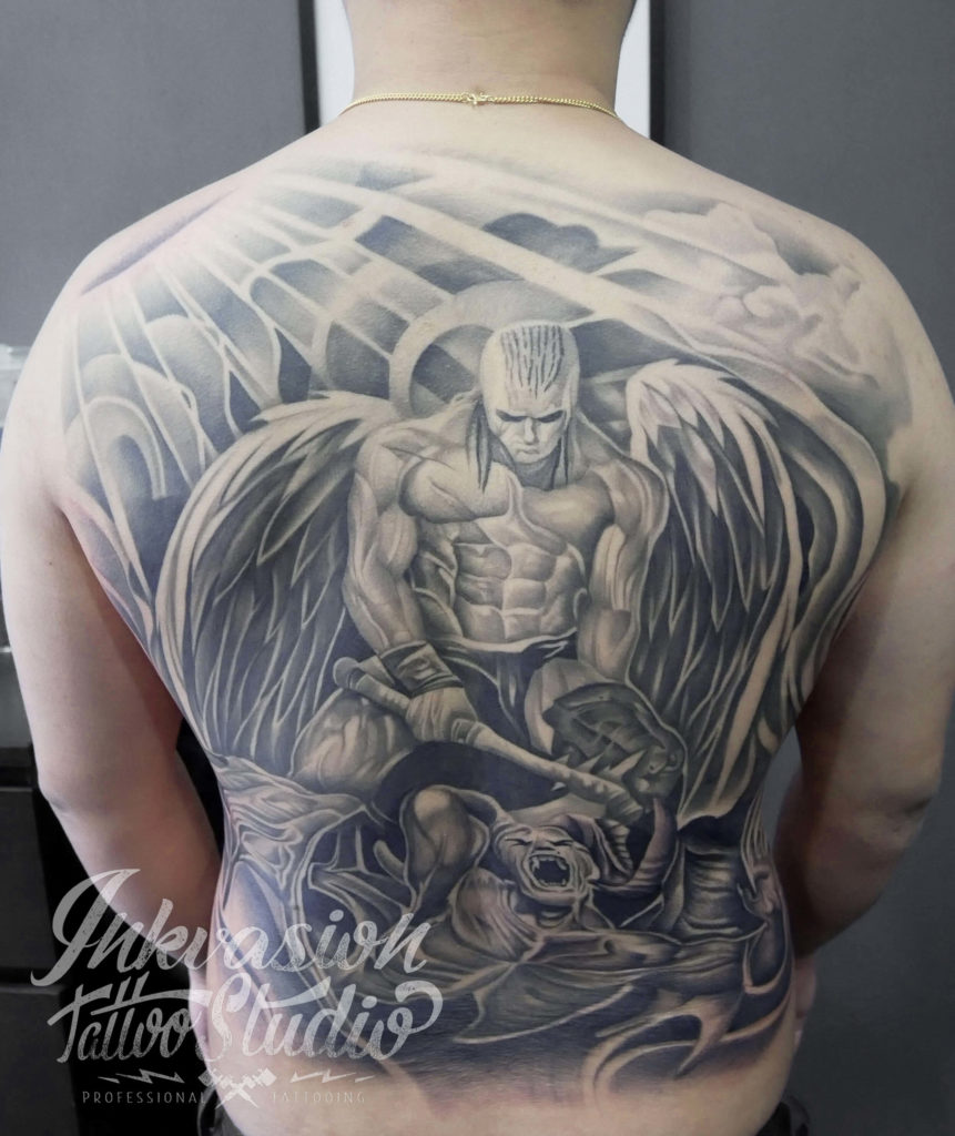 person with kneeling angel back tattoo photo  Free Tattoo Image on Unsplash