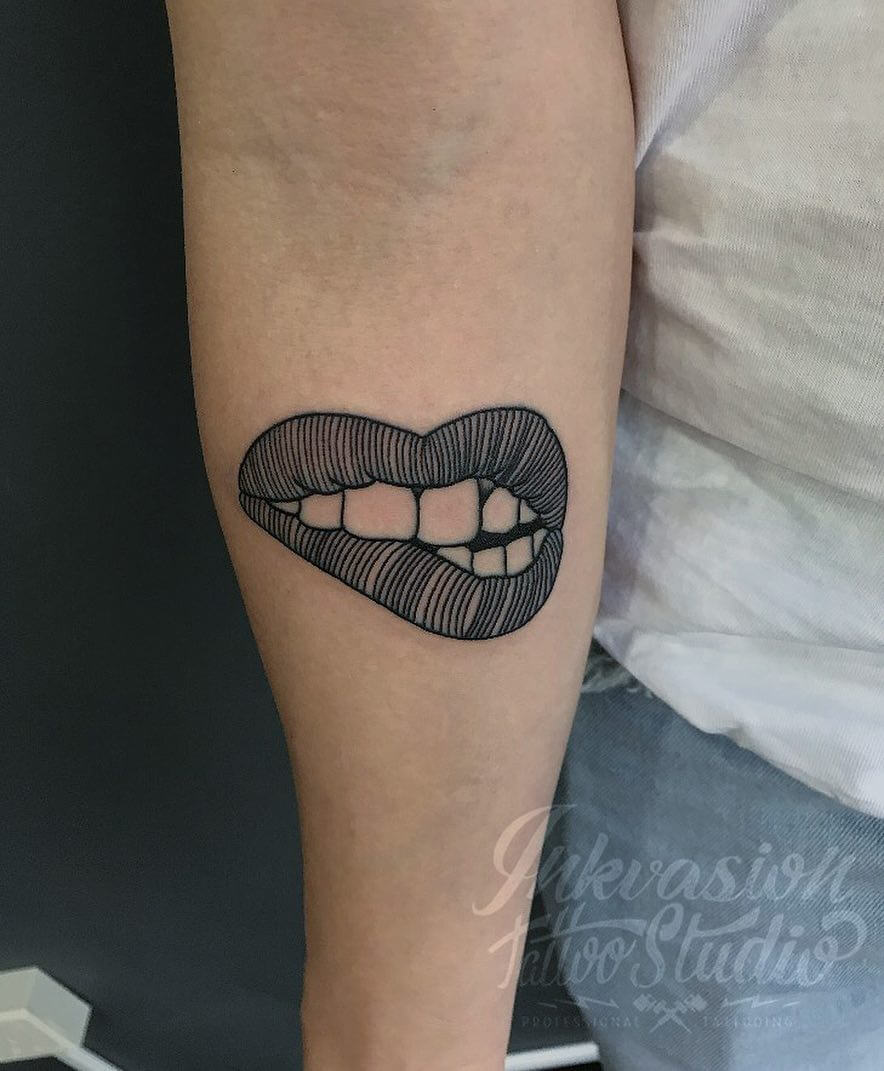 I got my girlfriend's lips tattooed on my face and instantly regret it