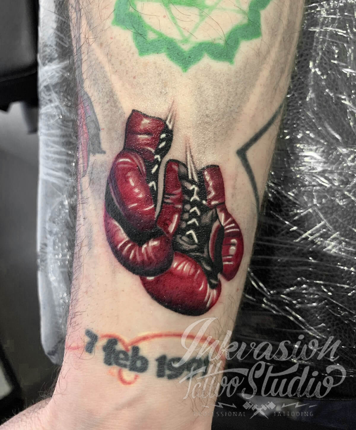 Microrealistic boxing gloves tattoo done on the inner