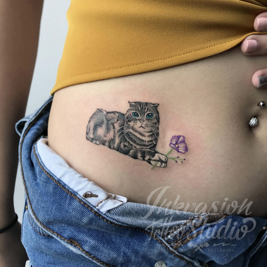 Cat Holding A Flower Tattoo
